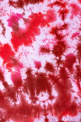 tie dye pattern hand dyed on cotton fabric abstract texture background.