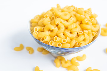 Raw macaroni in a bowl.