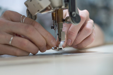 woman working on sewing machine