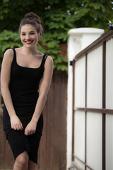 Portrait of beautiful young girl in summer garden.