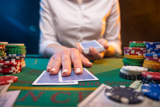 Playing poker or blackjack. Casino, playing in a night club.