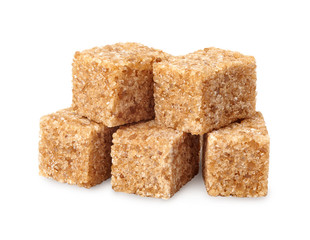 A heap of brown sugar cubes isolated on white background