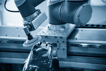 The polishing robotic arm sytem in the automotive parts painting process. The hi-technology in automobile industry by bobotic systems.