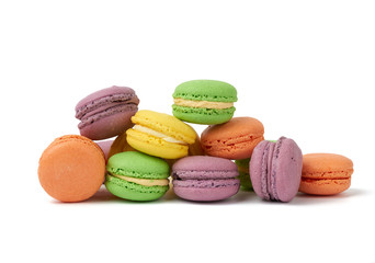 round baked multi-colored almond flour cakes macarons, dessert is laid out in a stack