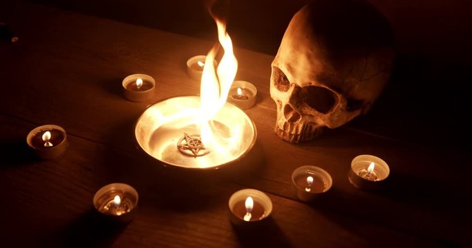 Burning pentacle on altar closeup footage