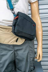 Casual model guy with small black shoulder bag