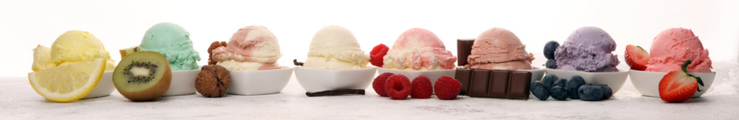 Various of ice cream flavor whit fresh blueberry, strawberry, kiwi, lemon, vanilla setup on rustic background . Summer and Sweet cold ice cream