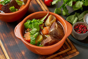 Goulash with large pieces of beef and vegetables. Slow stewing, cooking in two pot or cast-iron pan