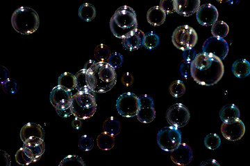 Naklejka premium Blurred of Bubble on black background, Bokeh with background.