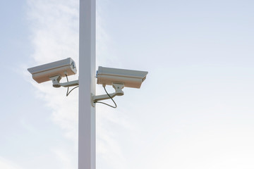 Closeup of traffic security camera on blue sky, Camera surveillance monitoring (CCTV)