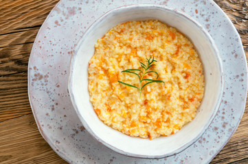 millet pumpkin porridge decorated with fried rosemary 