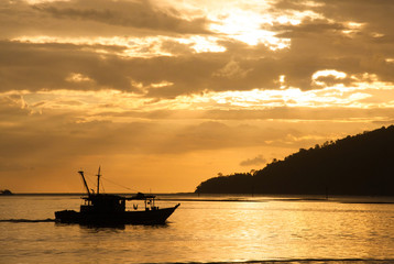 Fisher boat on sunset at the sea - Borneo, Indonesia