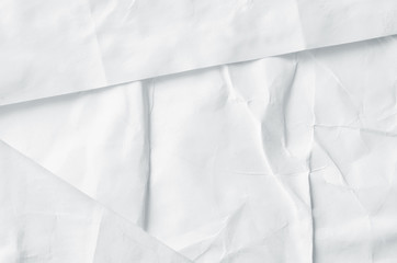 Creative background with scattered overlay of crumpled papers.