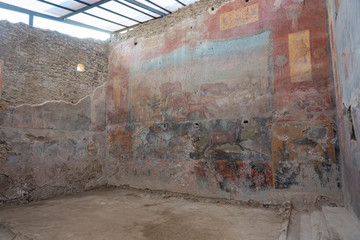 Ancient color wall paintings frescos in Pompeii, Italy.