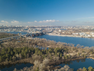 Fototapeta na wymiar Aerial drone view. Bridge in Kiev over the Dnieper River during construction.
