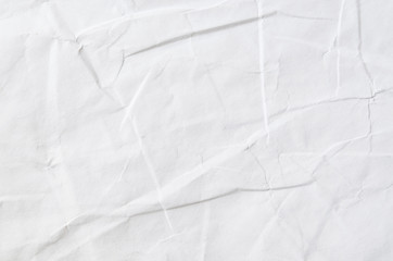 Creative background with scattered overlay of crumpled papers.