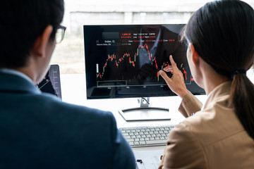 Business team partner working with computer, laptop, discussion and analyzing graph stock market trading with stock chart data planning, financial and investment concept