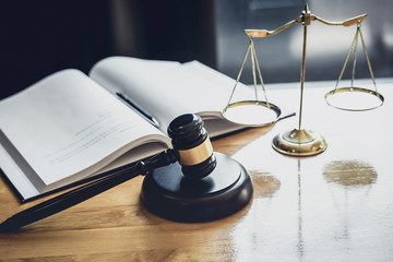 Judge gavel with Scale of justice, object documents working on table in courtroom, Legal law advice...