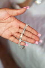 Woman holding  a bracelet