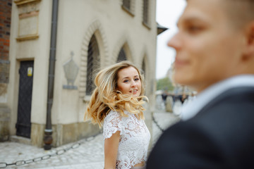 Naklejka premium Two lovers walk along Krakow