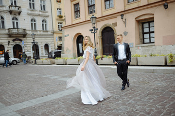 Two lovers walk along Krakow