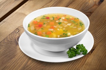 Bowl of delicious vegetable soup on a table