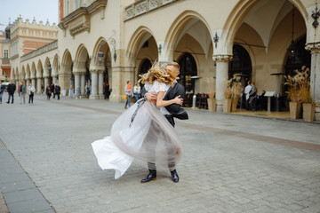 Two lovers walk along Krakow