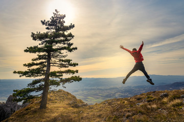 Active young man feeling free. Experience freedom in the heart of nature.
