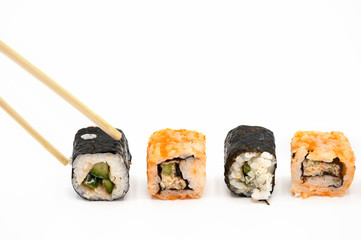 Japanese restaurant food. hand pick sushi roll with chopsticks on white isolated background . 