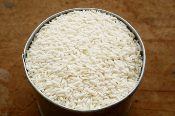 white rice in a bowl and wood background