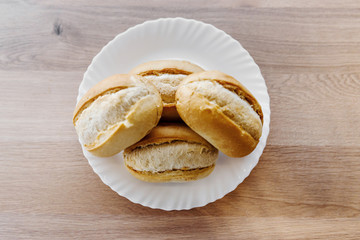 bread in a plate,lying bread in a plate to prepare for fast food,sandwich for butter,fast food butter lies in the kitchen utensil on the table