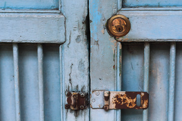 Old vintage key hole on blue door.