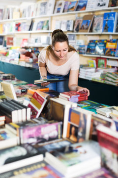 Woman buying textbooks
