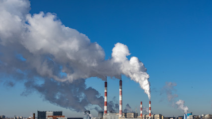 Thick white smoke, the release of toxic substances. Factory pipes polluting the air, environmental...