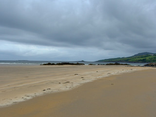 landscape with sandy beach by the ocean