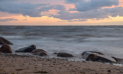 beautiful sunset landscape on a rocky beach,