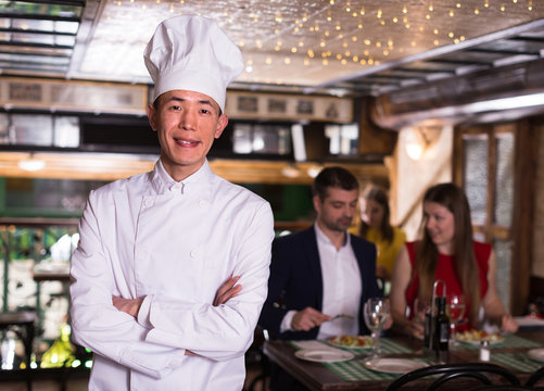 Smiling Chef Cook Is Posing In Hall