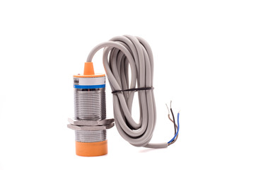 Inductive proximity sensor or proximity switch installed on the machine.