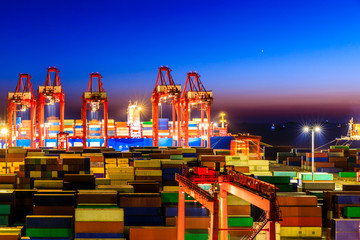 Industrial port container freight terminal at night in Shanghai,China.