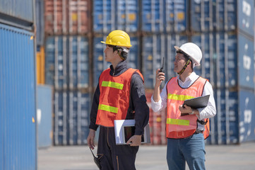 Foreman control loading containers box from cargo freight ship for import export, Foreman control...