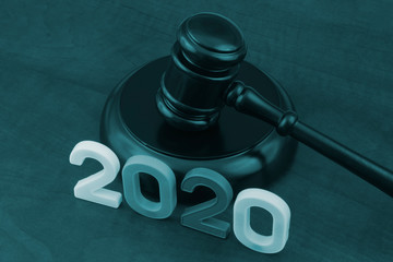 Judge gavel and numbers 2020 on table. Concept of new laws and rules of 2020 year