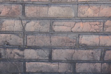 brown stone texture from old dirty bricks in a house wall