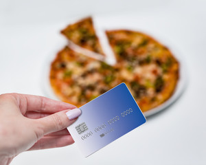 Concept sale. Purchase of pizza, payment by credit card.