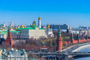 Fototapeta premium View of Moscow Kremlin and the bell tower of Ivan the Great and Russian weapons with moscow cityscape, Moscow, Russia