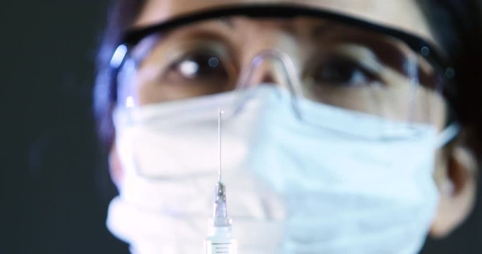 Researcher Working In A Laboratory, Asian Woman, Scientist, Covid-19, Epidemic. Chinese, China