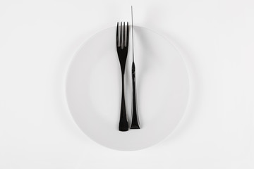 White ceramic round plate isolated on white. Excellent food concept.