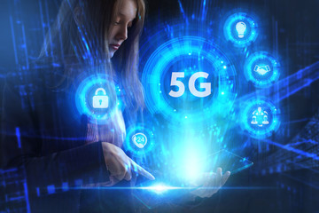 Fototapeta premium Business, Technology, Internet and network concept. Young businessman working on a virtual screen of the future and sees the inscription: 5G
