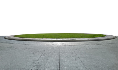 Empty cement ground with round small green garden