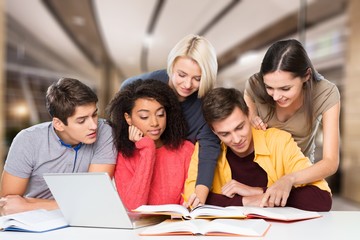 Team of young students studying with books