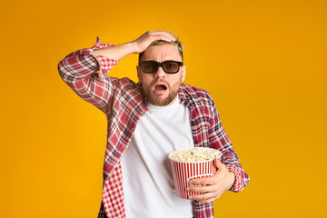 Experiencer Young guy in 3d glasses watching cinema